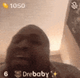 a close up of a man 's face with the words " drebaby " on the bottom