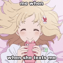 a girl laying on a bed holding a cell phone with the caption me when she texts me