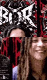 a woman with dreadlocks is smiling in front of a poster for a band called black sabbath