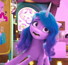 a purple pony with blue hair and a horn is standing in front of a bulletin board
