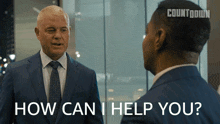 a man in a suit and tie is talking to another man with the words how can i help you