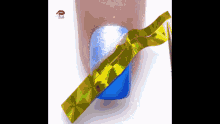 a close up of a person 's nails with a blue and gold design on them .