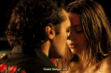 a man kissing a woman with sweat hunger life written on the bottom