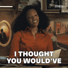 a woman is smiling and holding a piece of paper that says " i thought you would ve "