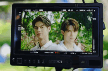 two men are on a screen that says smoihd on it
