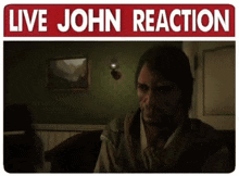 a sign that says live john reaction with a man in a dark room