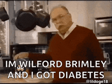 a man in a red sweater is standing in a kitchen and says " im wilford brimley and i got diabetes . "
