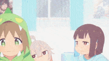 two anime girls are laying under a blanket and one is smiling