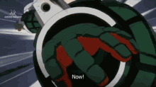 a cartoon character says " now " in front of a giant bomb