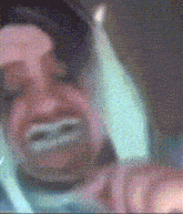 a blurry picture of a person holding a candle in their mouth