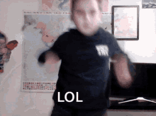a boy wearing a black shirt that says rock star