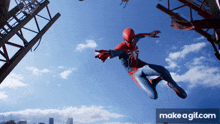 a spider-man is flying through the air with a make a gif.com logo in the corner