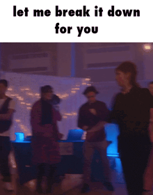a group of people are dancing in a dark room with the words " let me break it down for you "
