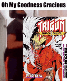 a man standing next to a book called trigun maximum