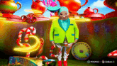 a man in a green suit stands in front of a candy land