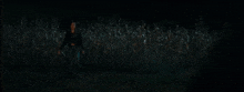 three girls are screaming in a dark room