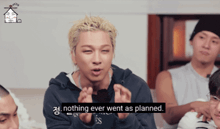 a man says nothing ever went as planned in front of a group of people
