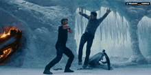 two men are standing in a cave with the words pranay and varma on the bottom