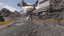 a helicopter with the letter o on it is flying over a building