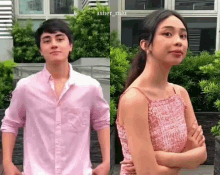 a man in a pink shirt is standing next to a woman in a pink dress