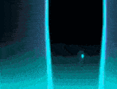 a blue light shines on a dark background