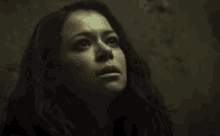 a close up of a woman 's face looking up