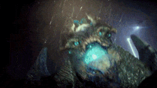 a creature with a blue light coming out of it 's mouth