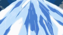 a mountain covered in snow and ice with a blue sky in the background