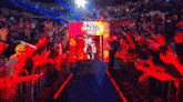 a man is walking through a tunnel with a sign that says what 's up
