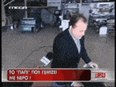 a man in a suit is being interviewed by a mega channel reporter