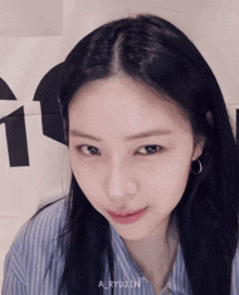 a close up of a woman 's face with the name a_ryujin visible