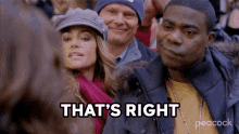 a man says that 's right while standing in a crowd