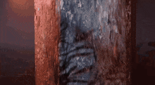 a person is standing in front of a red and blue wall