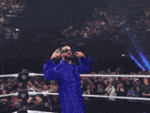 a man wearing sunglasses and a purple jacket
