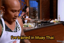 a man in a chef 's apron says " i 've trained in muay thai "