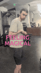 a man standing in a gym with the words feeling magical behind him