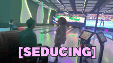 a bowling alley with the words seducing in pink