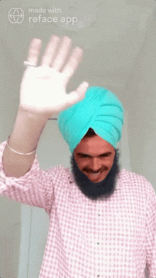 a man wearing a turban is waving his hand in front of a sign that says reface app