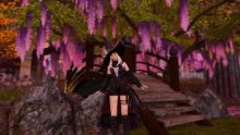 a woman in a witch costume is standing in front of a bridge
