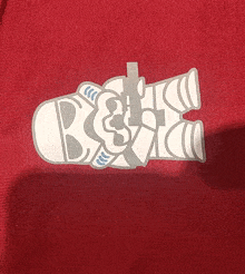 a red shirt has a sticker on it that says ' best '