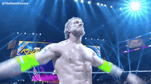 a shirtless wrestler is standing in front of a sign that says revolution