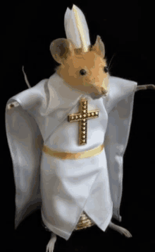 a mouse dressed as a pope with a gold cross