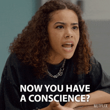 a woman with curly hair says " now you have a conscience " on a netflix ad