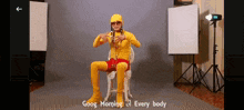 a man in a yellow outfit is sitting in a chair with the words " good morning of every body " written below him