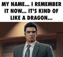 a man in a suit and tie is standing in front of a sign that says my name i remember