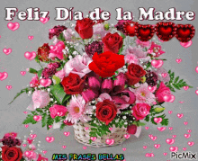 a bouquet of flowers with the words feliz dia de la madre written on it
