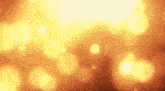 a blurred image of a yellow background with a lot of lights coming out of it .