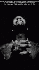 a black and white photo of a man praying