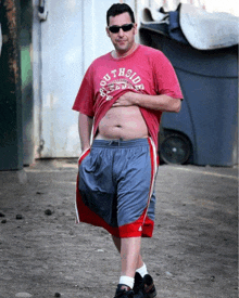 a man wearing sunglasses and a red shirt that says southside