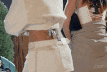 a group of women are standing next to each other .